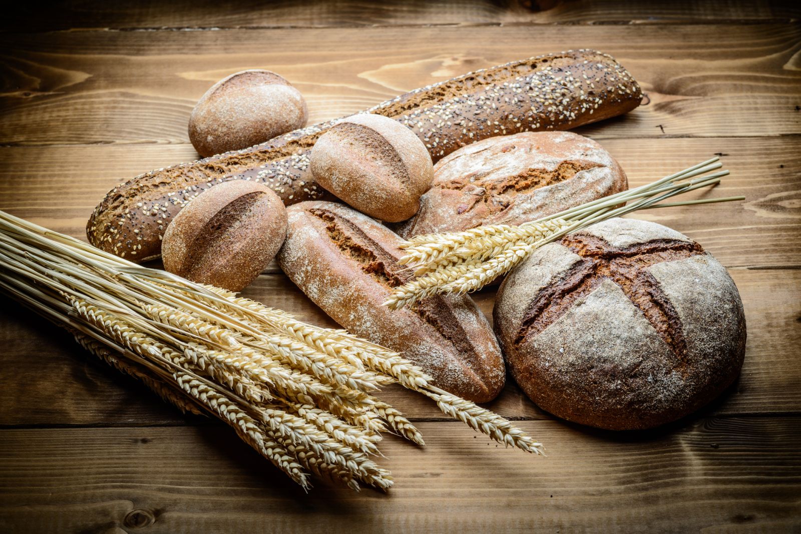 Wheat and bread on a table by scorpp via iStock